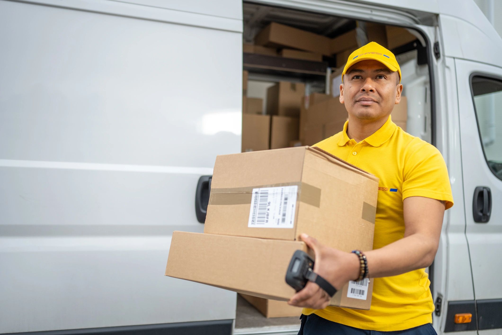 Delivery driver carrying packages