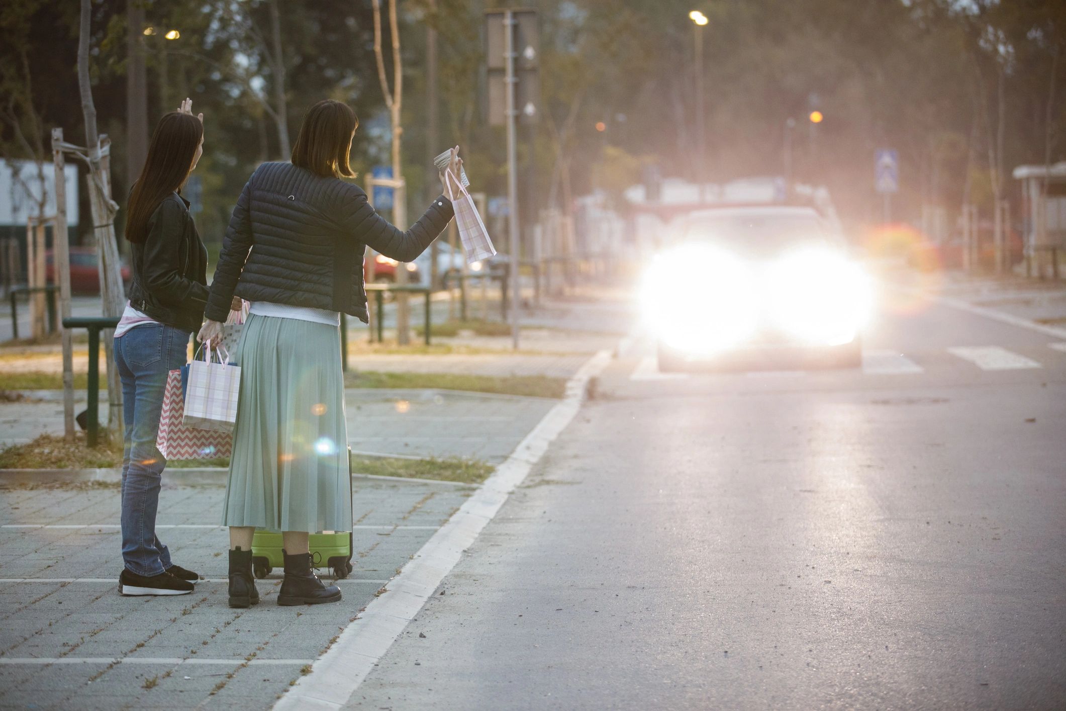 Customers hailing a ride on a city street