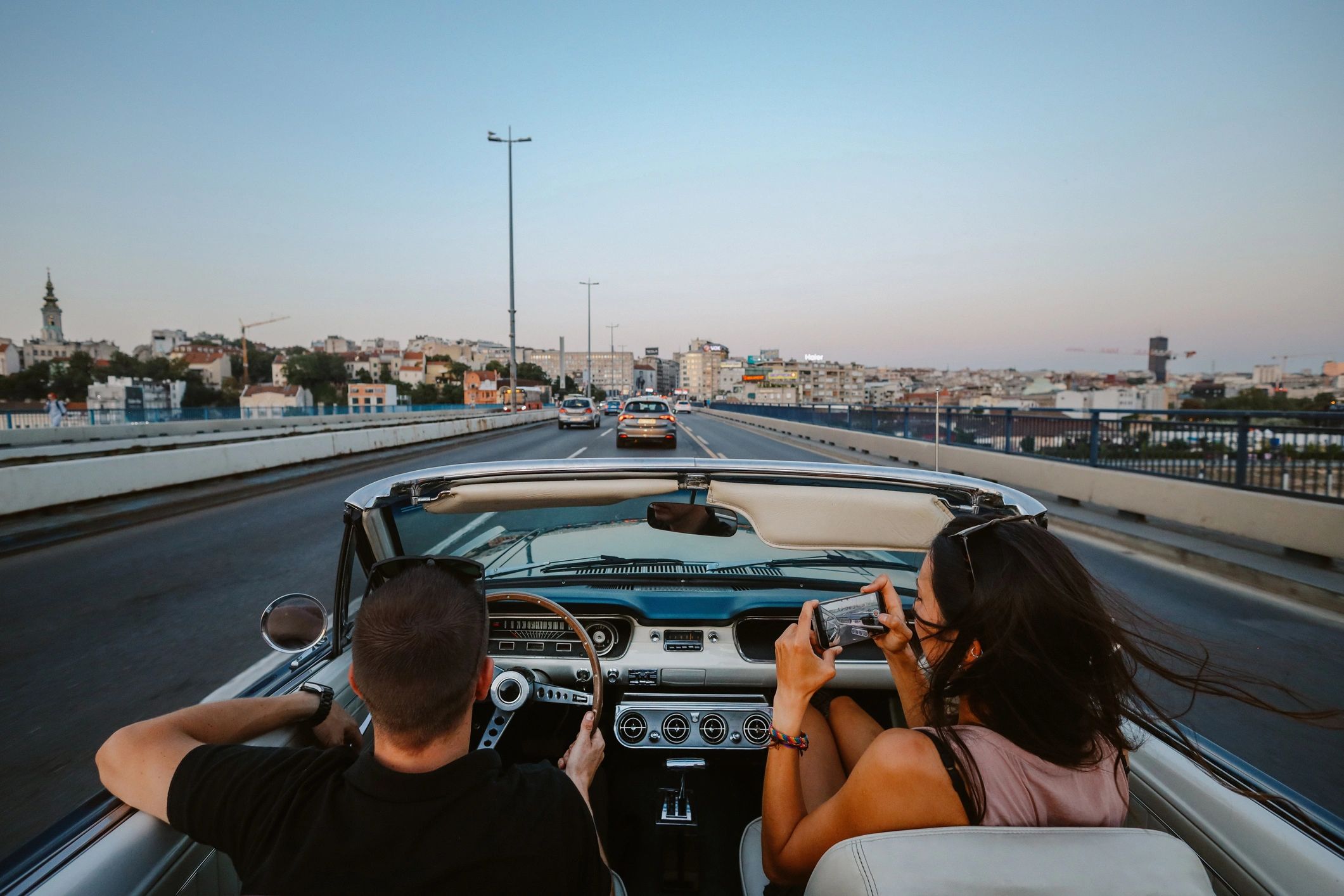 Passengers enjoying a city ride in a car